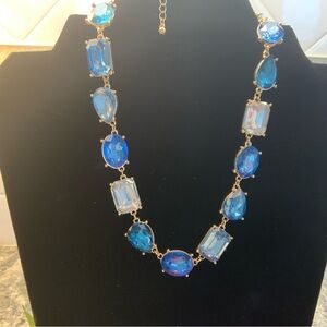 Brand new, two piece set of a blue crystal necklace 18k gold plated & earrings.